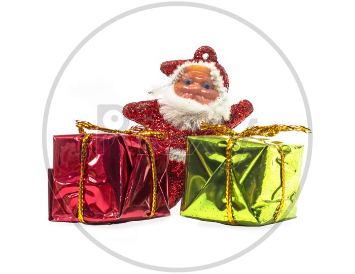 Santa Claus With Gift Box Isolated On A White Background.