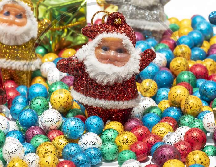 Santa Claus And Colorful Balls On White Background.