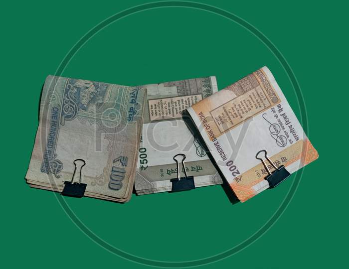 Indian currency notes of five , two and one hundred rupees.