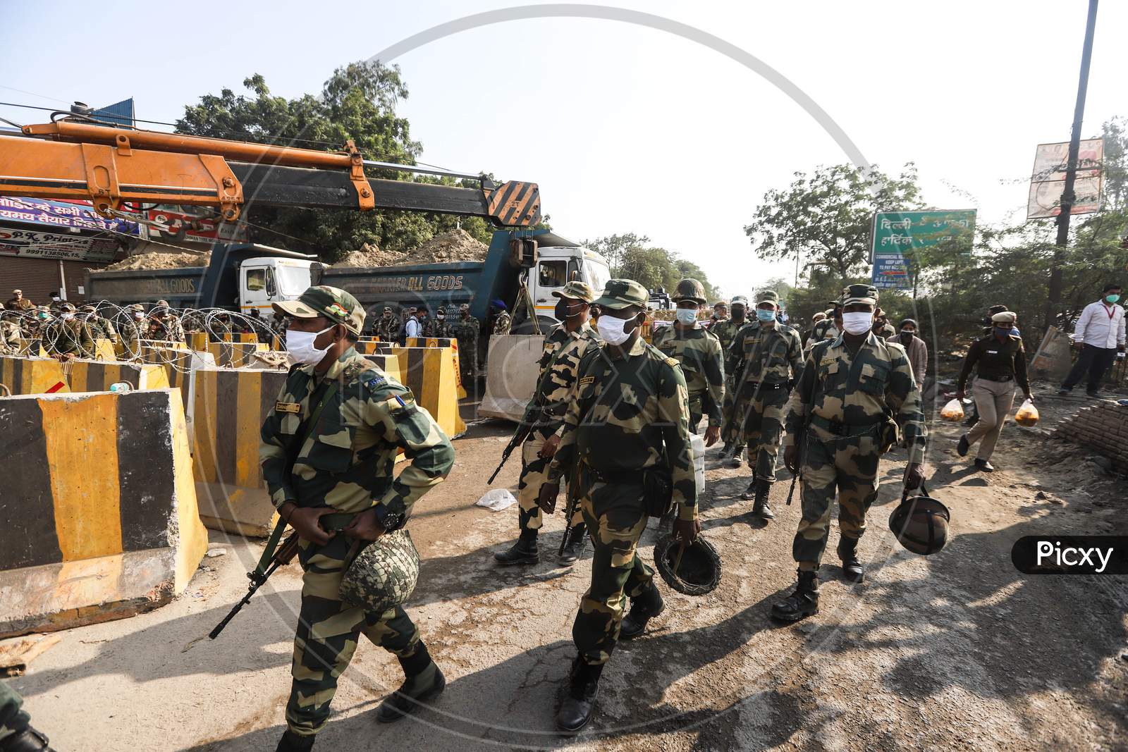 Heavy security at  Haryana-New Delhi border to stop agitating farmers. Farmers are protesting against  new farm laws that they fear will reduce their earnings and give more power to large retailers.