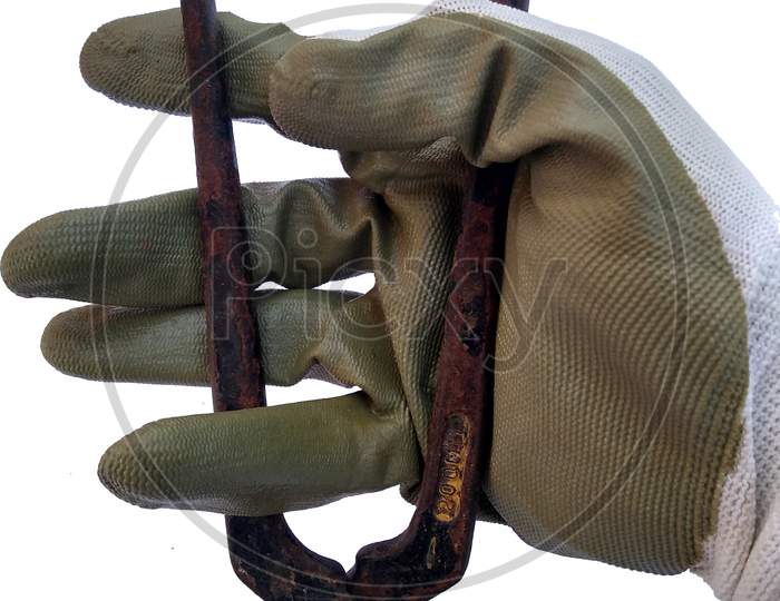 Hand With Protection Gloves Holding To The Plier On White Background.