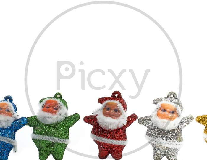 Christmas Composition. Multi-Colored Santa Claus Decorations On White Background. Copy Space