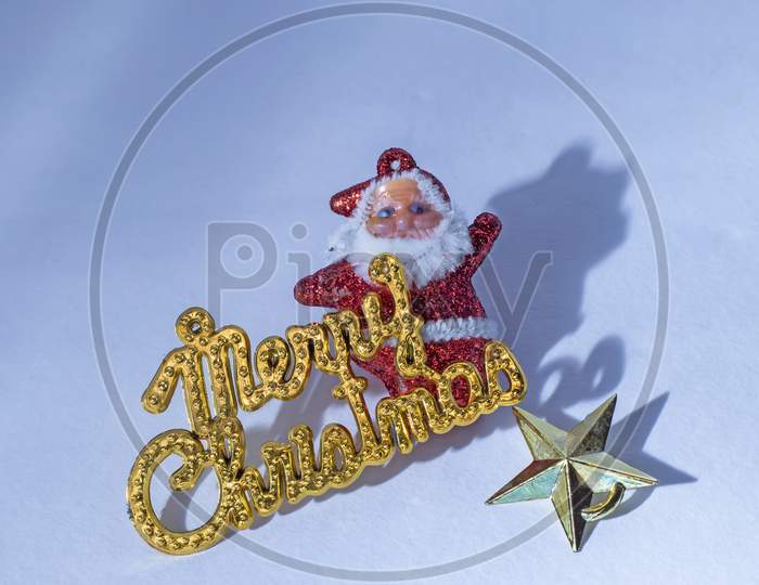 Merry Christmas Gold Text With Santa Claus Isolated On White Background