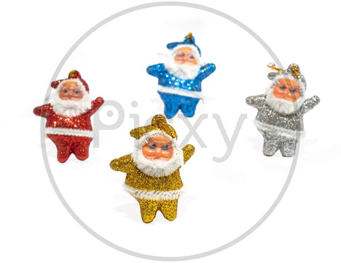 Multi-Colored Santa Claus On A White Background. Copy Space.