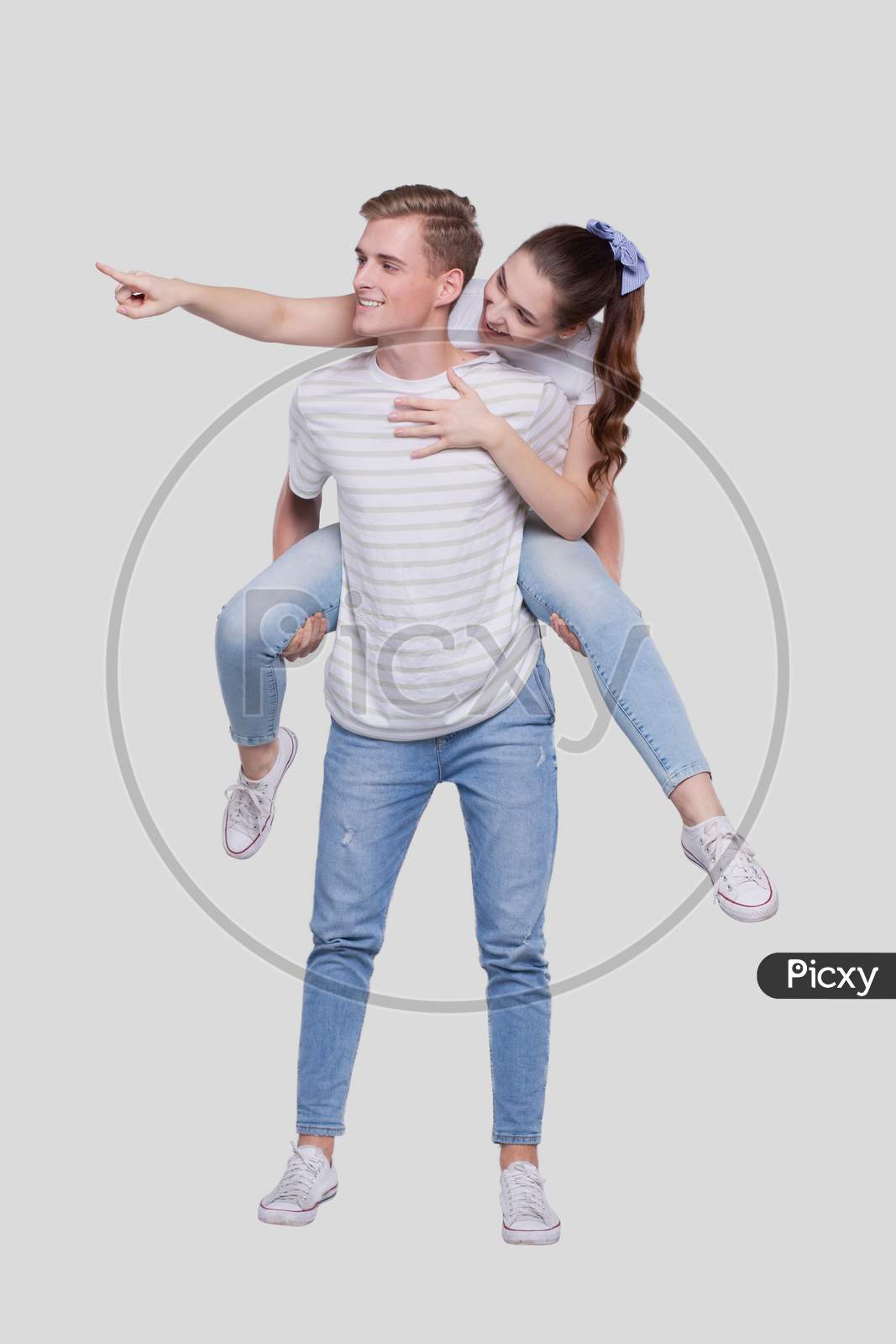 Girl Riding Man Back. Man Holding Girl. Couple Isolated. Girl On Man Back Sitting. Girl Pointing To Side