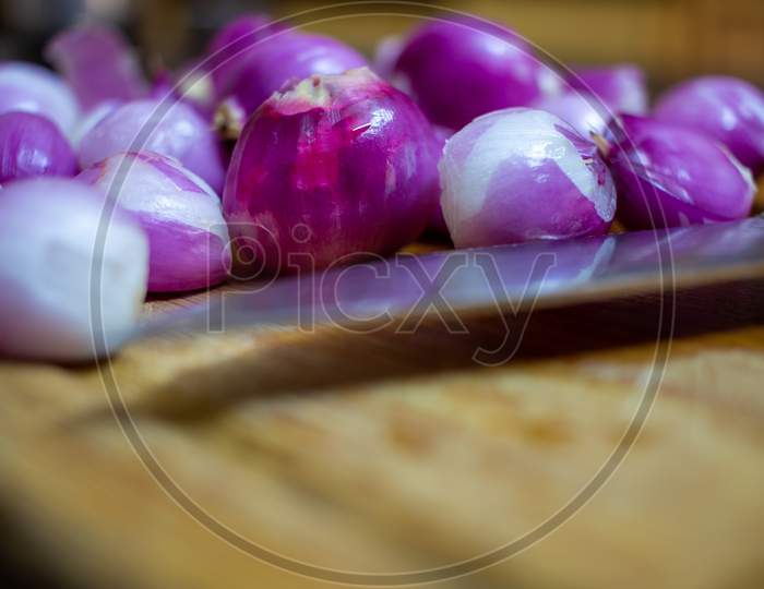 Peeled Onions (Shallots) Ready For Cut And Used In Cooking.