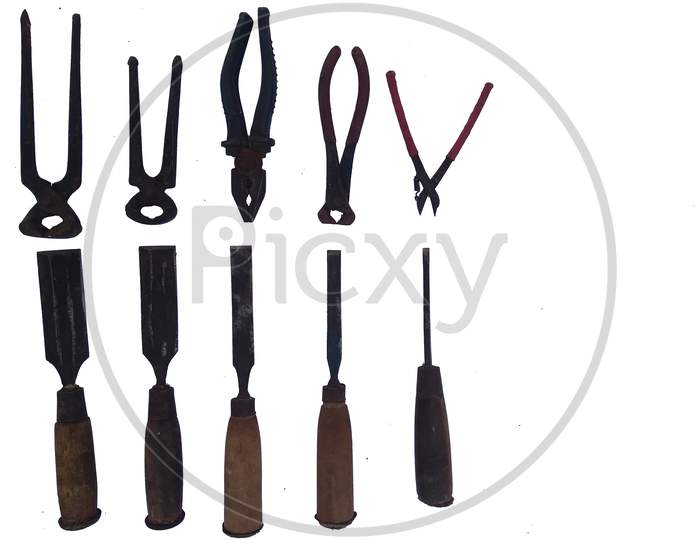 Different Types Of Carpenter Tools Like Chisel And Pliers Isolated On White Background.