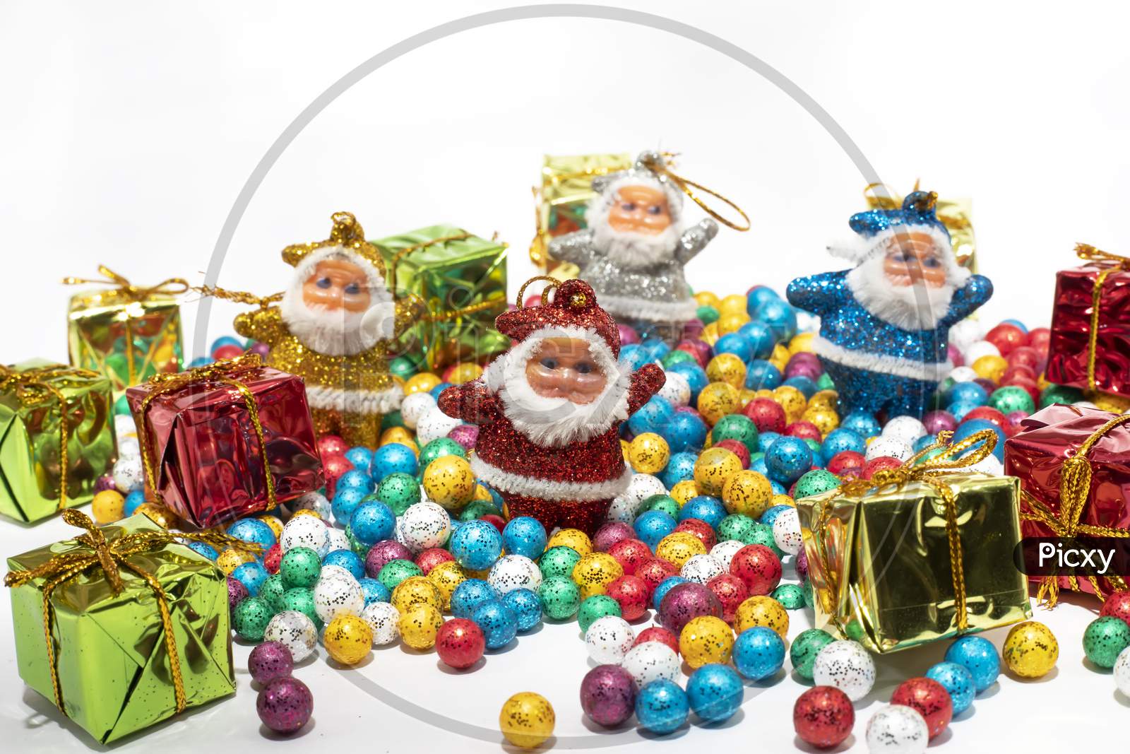 Santa Claus With Colorful Balls And Gift Boxes On White Background.