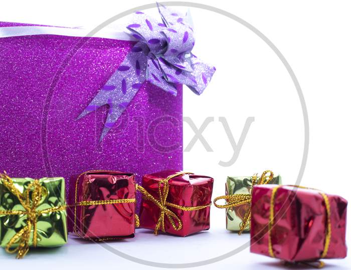Christmas Gift Box. Christmas Presents In Multi-Colored Boxes Isolated On A White Background