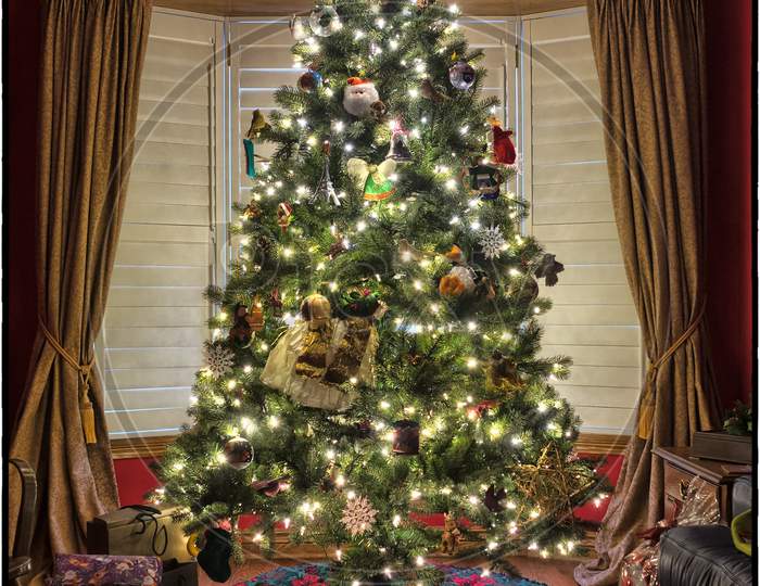 christmas tree decorations. christmas tree with lights. christmas tree at night. christmas gifts.christmas gift box