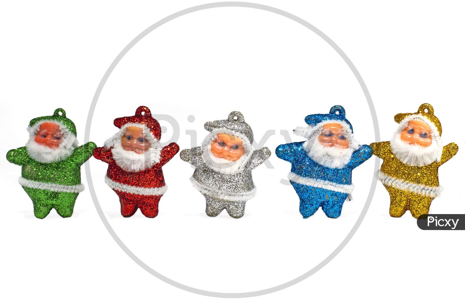 Multi-Colored Santa Claus Decorations On White Background. Copy Space