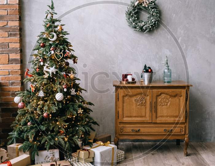 christmas tree decorations. christmas tree with lights. christmas tree at night. christmas gifts.christmas gift box