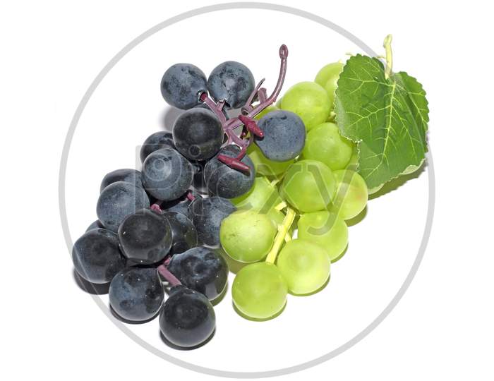 Black And Green Grape With Leaves Isolated On White Background With Clipping Path. Studio Shot. Collection