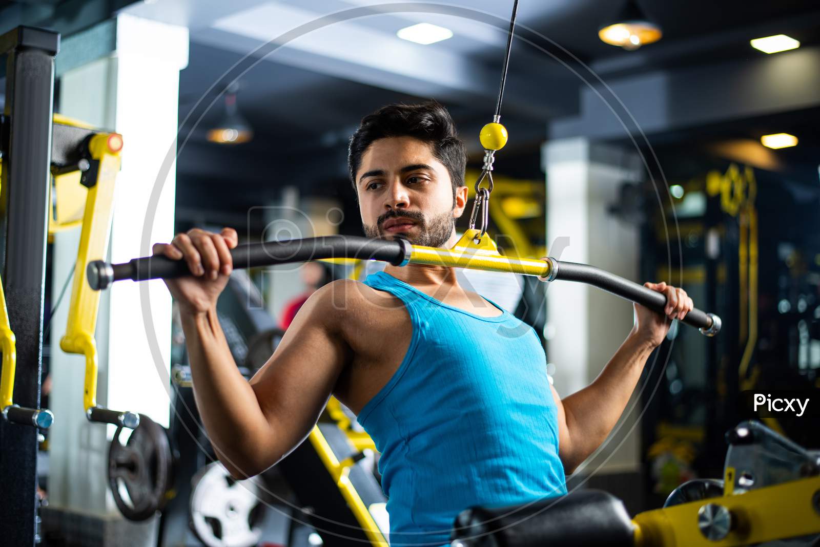 Small Titlehandsome Asian Indian Young Man Working Out In A Modern Gym