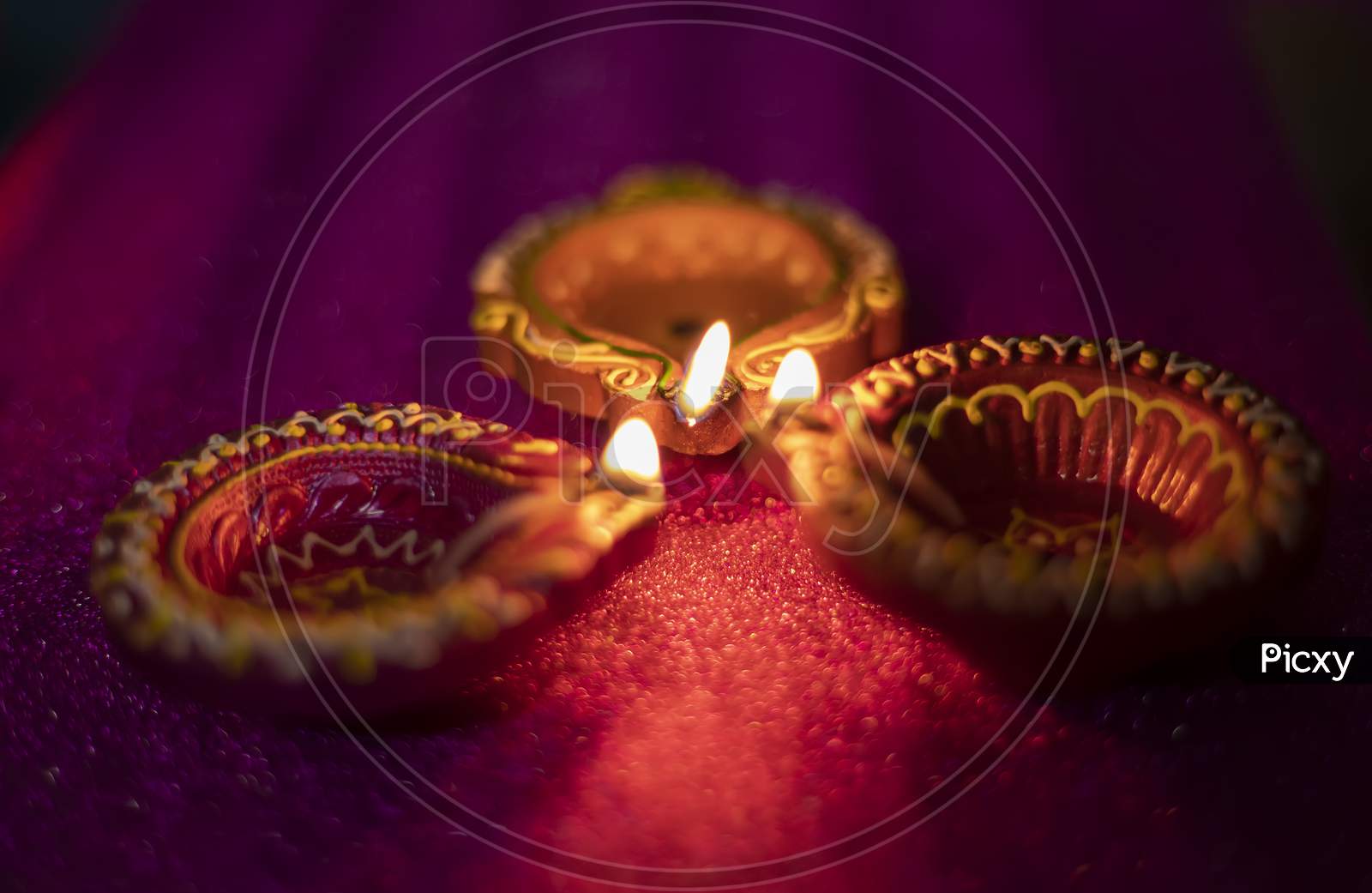 Happy Diwali - Colorful Clay Diya Lamps Lit During Diwali Celebration