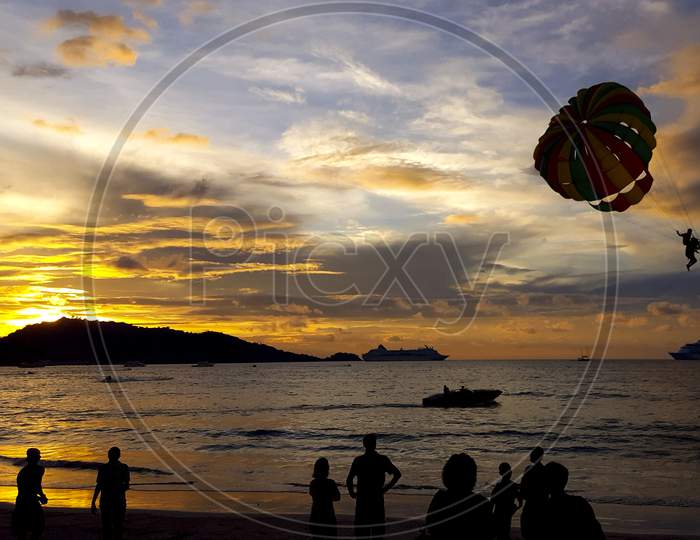 sunset view with paragliding at thailand