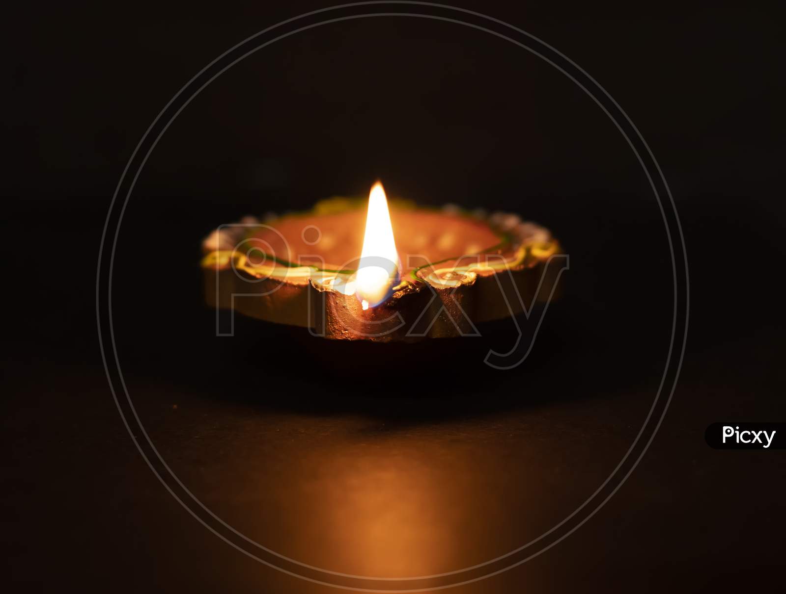 Traditional Clay Diya Lamps Lit During Diwali Celebration