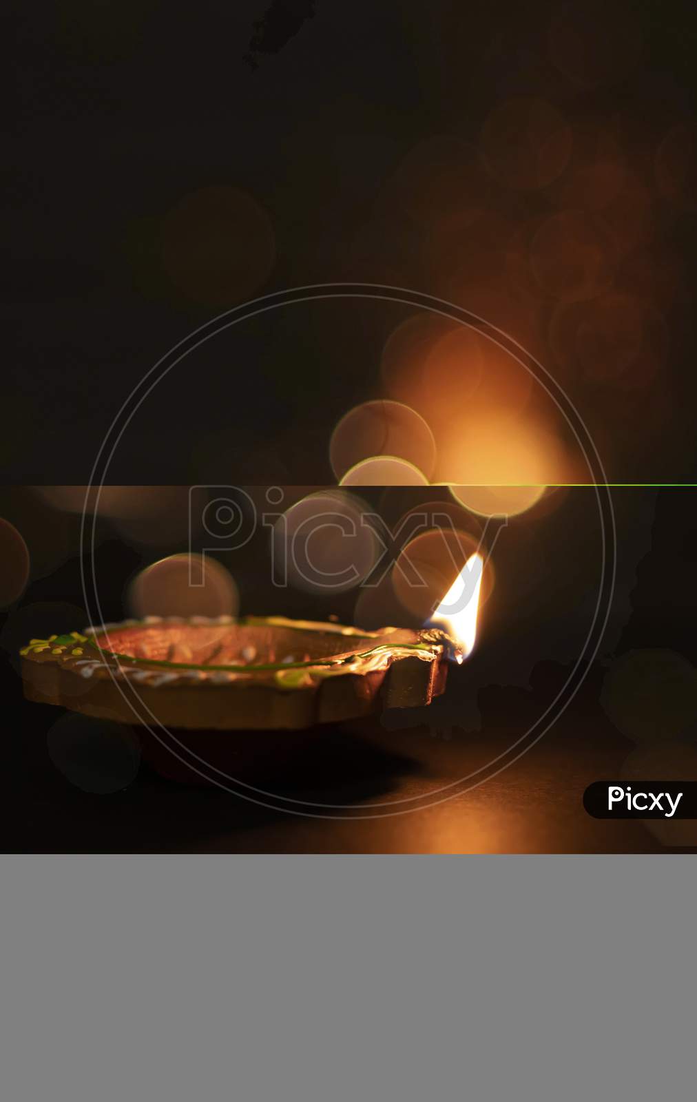 Diwali Celebration - Diya Lamp With Glitter Light Background