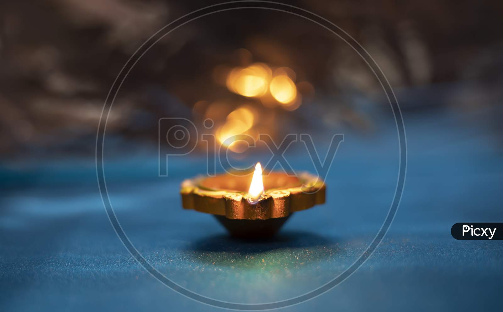 Colorful Clay Diya Lamps Lit During Diwali Celebration, Selective Focus