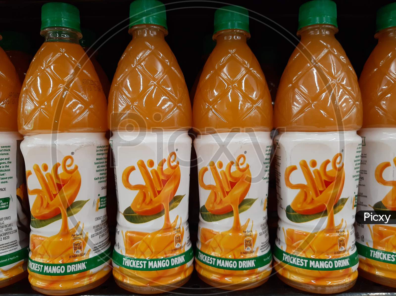 kochi, India - 23 April 2021 : Bottles of slice mango drink in supermarket