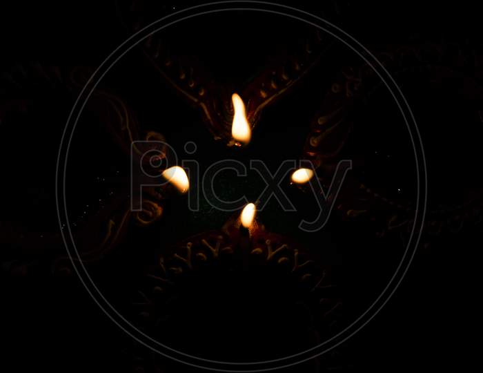 Traditional Clay Oil Lamps Fire On Dark Background