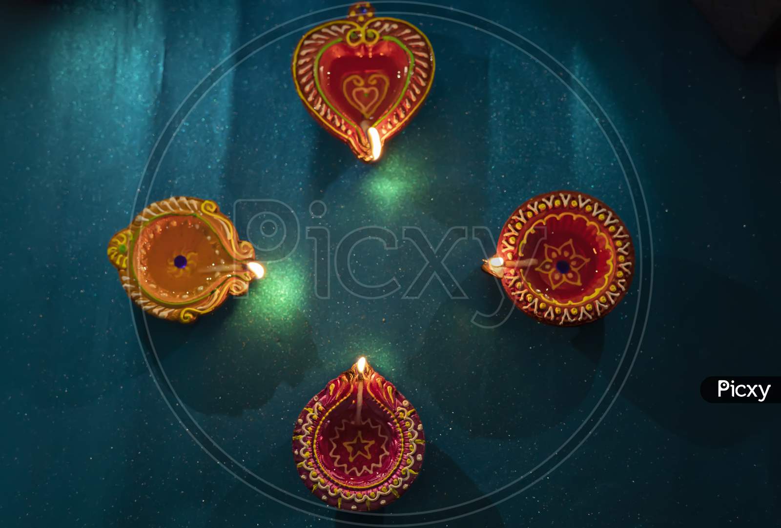 Happy Diwali - Colorful Clay Diya Lamps Lit During Diwali Celebration
