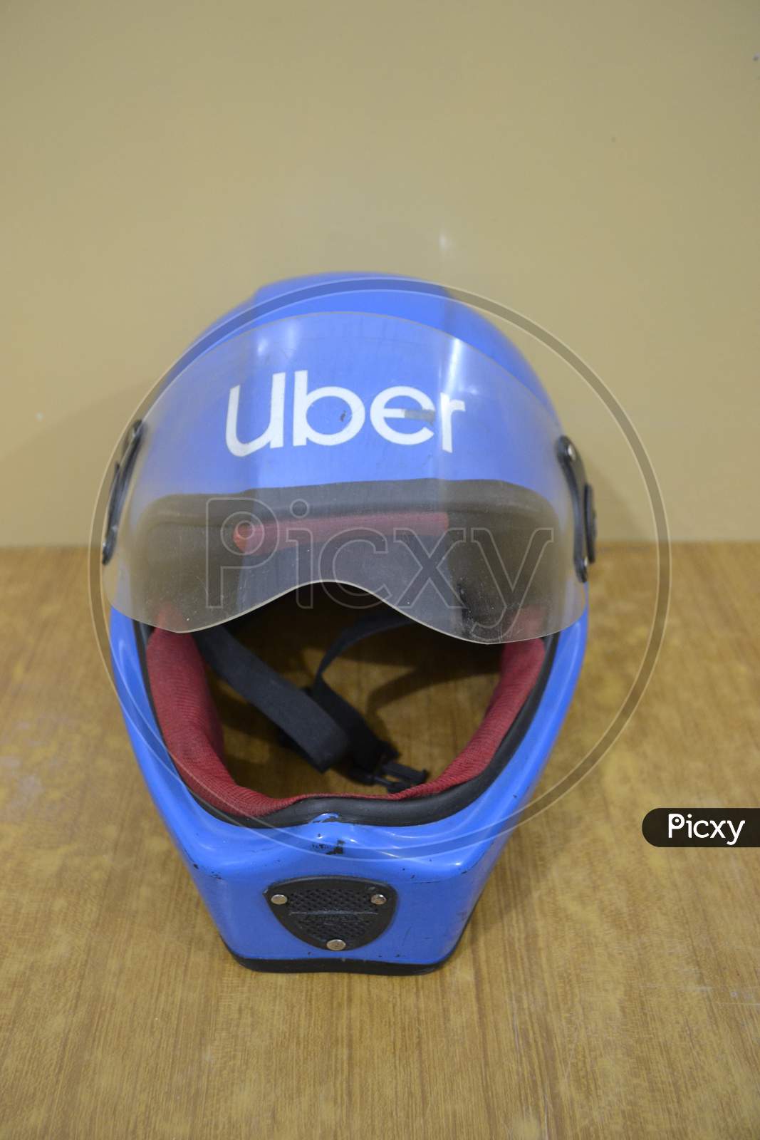 Blue motorcycle helmet, Uber.