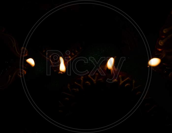 Traditional Clay Oil Lamps Fire On Dark Background