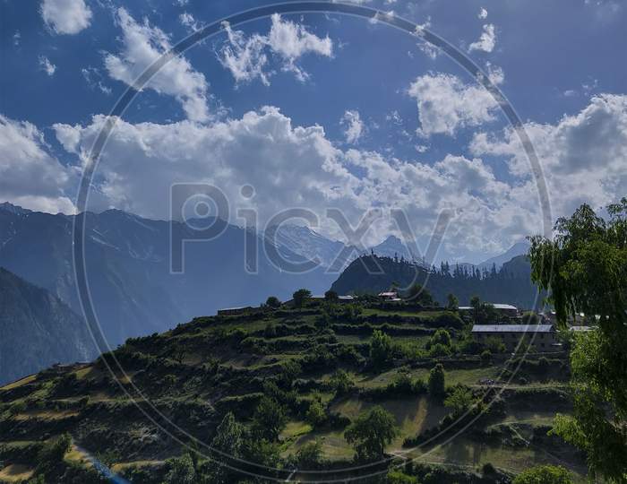 landscape view of hill and clouds
