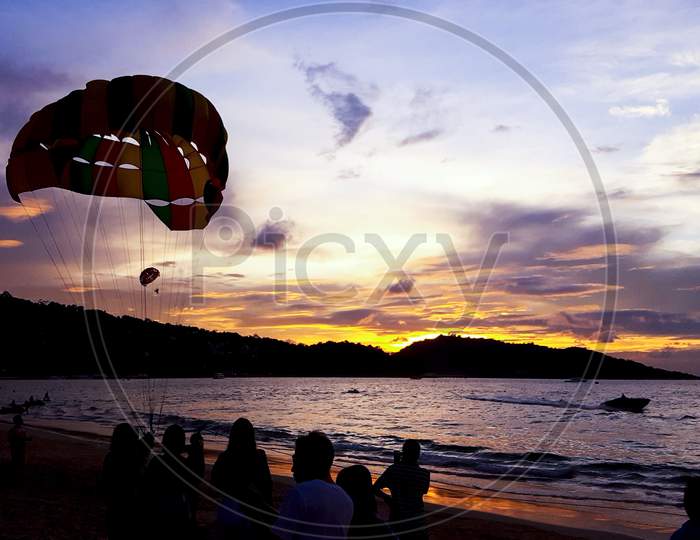 sunset view with paragliding at thailand
