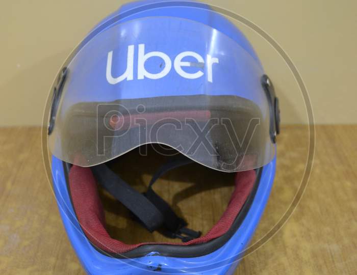 Blue motorcycle helmet, Uber.