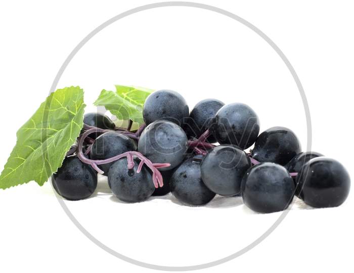 Bunch Of Black Grape Isolated On White Background.