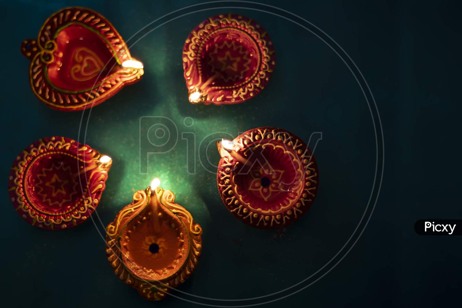 Colorful Clay Diya Lamps Lit During Diwali Celebration