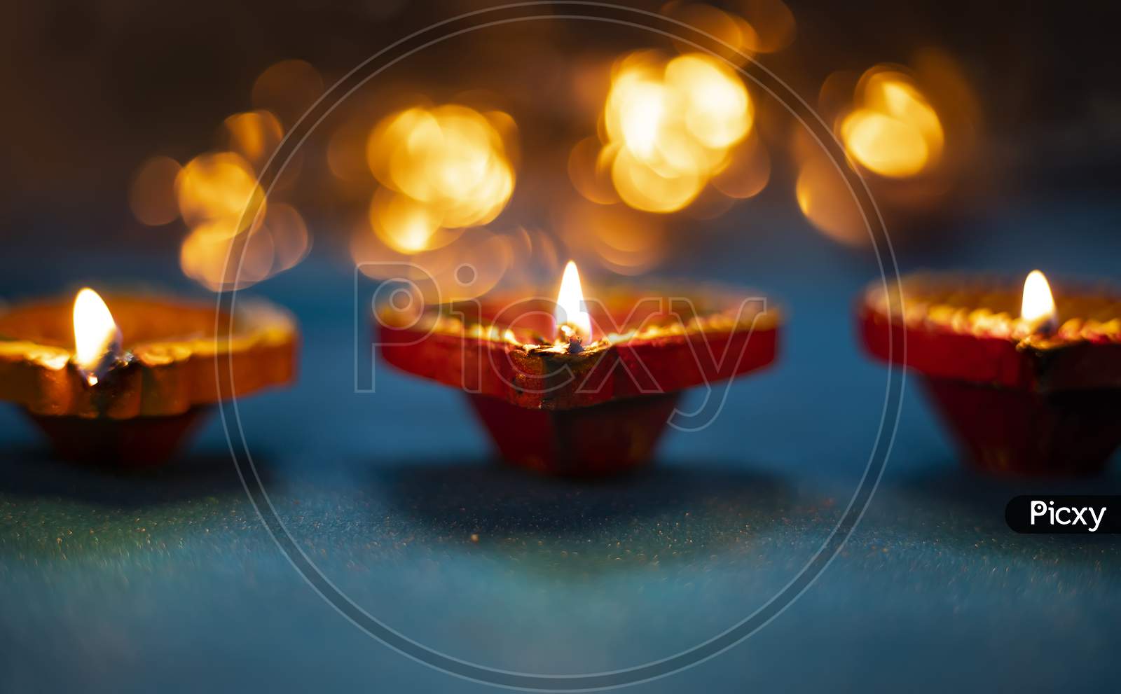 Happy Diwali - Colorful Clay Diya Lamps Lit During Diwali Celebration With Glittering Bokeh