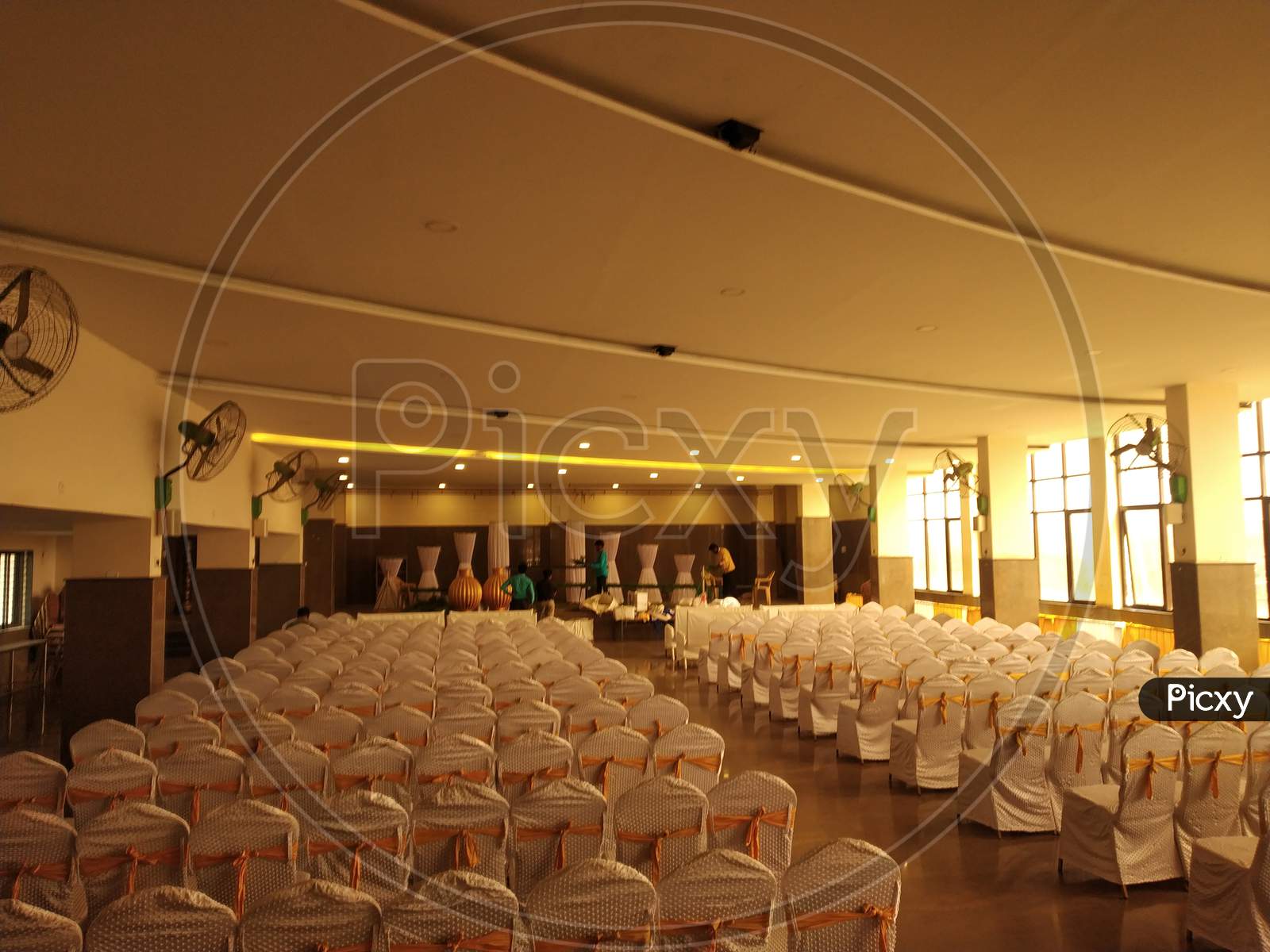 Empty marriage hall with empty decorated chairs
