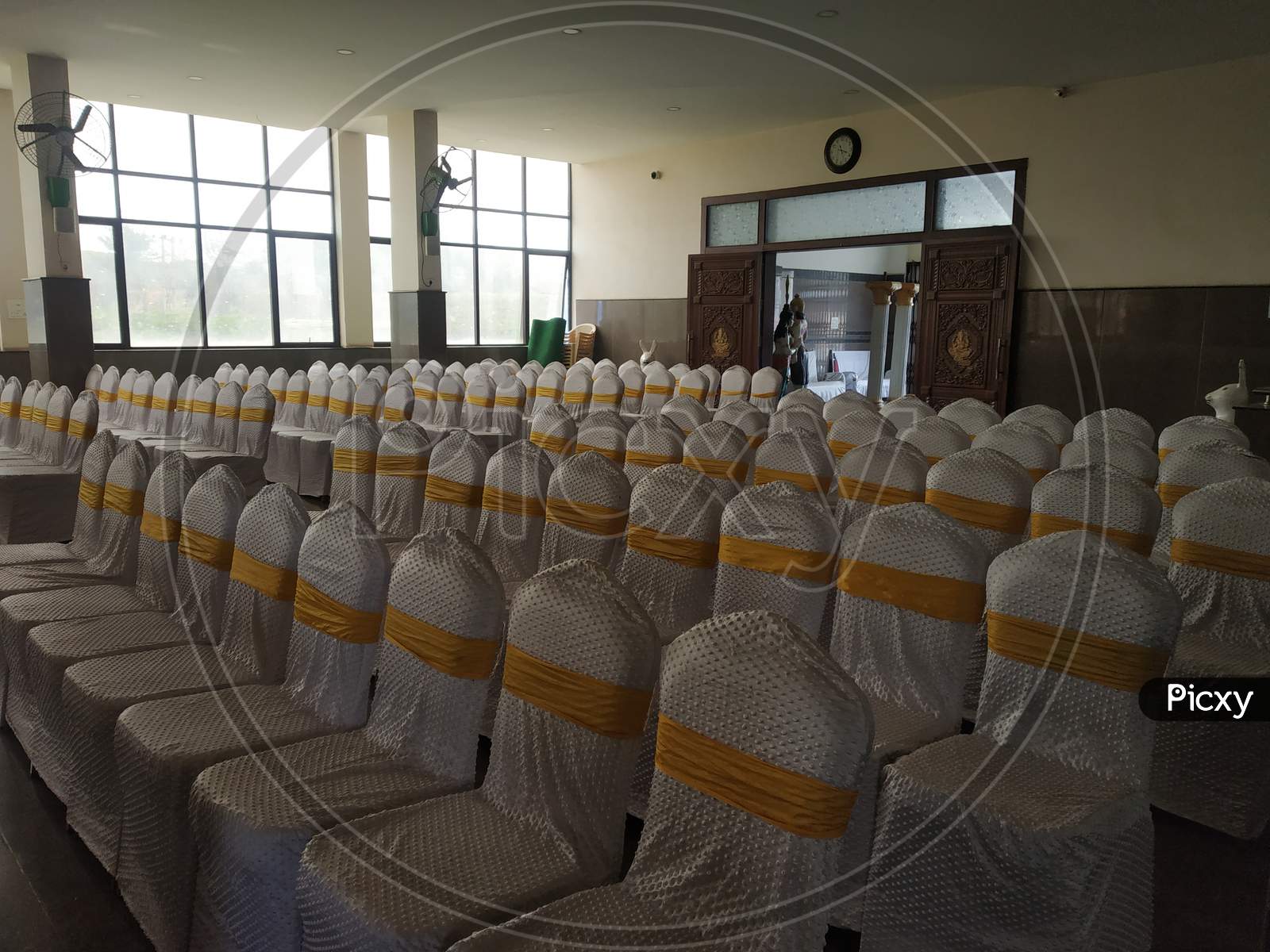 Empty function hall with white chairs