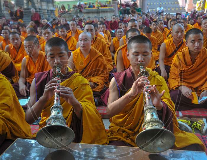 Buddhist Monks offering prayers