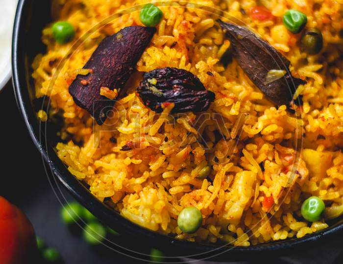Delicious Indian Pulao or Rice full of spices in flat lay to stay healthy and menu