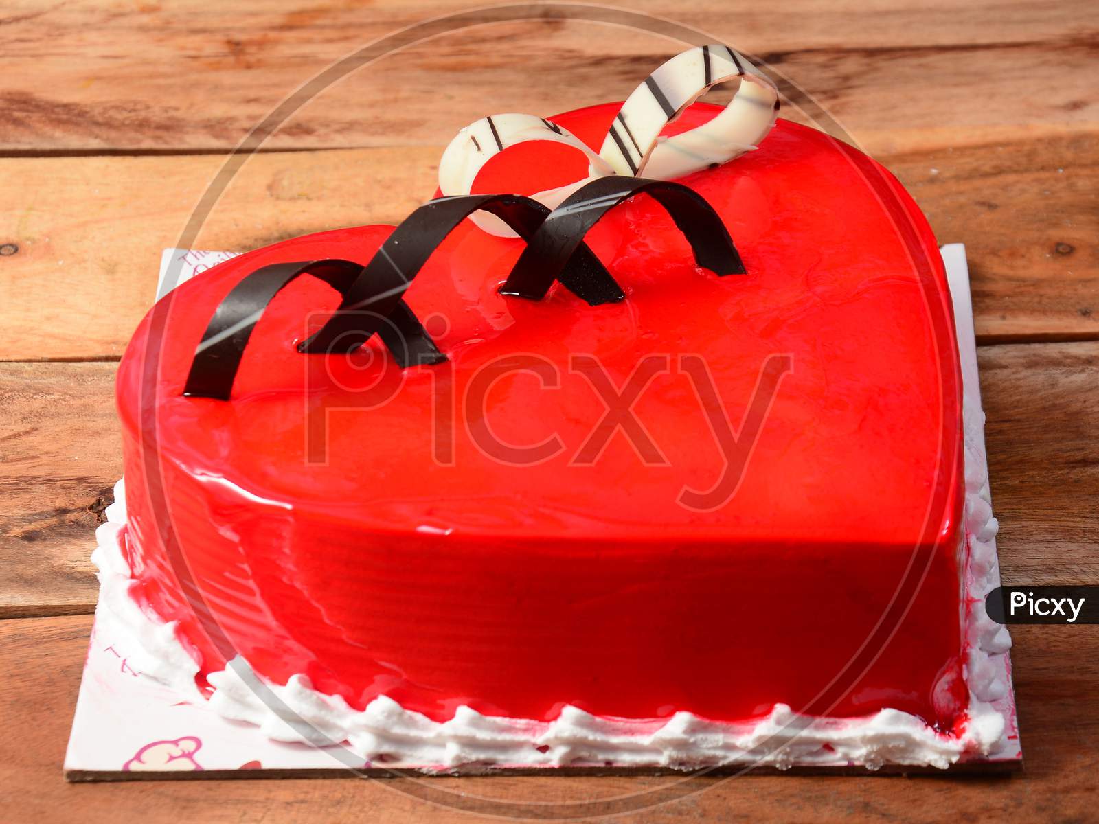 Freshly Made Strawberry Cream Cake On Wooden Table. Selective Focus