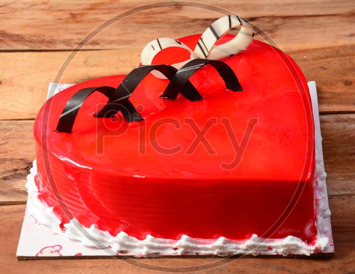 Freshly Made Strawberry Cream Cake On Wooden Table. Selective Focus
