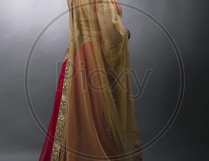 Middle aged Indian woman wearing traditional designer wear