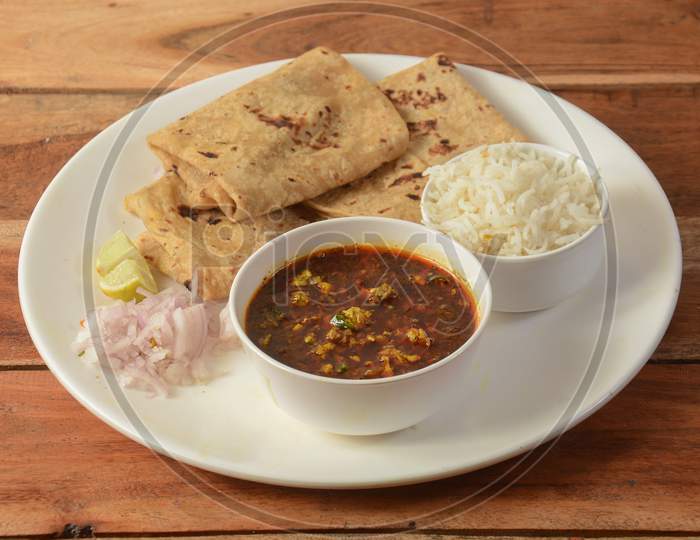 Assorted Indian Food Egg Gravy,Chapati And Boiled Rice On Wooden Background. Dishes And Appetizers Of Indian Cuisine