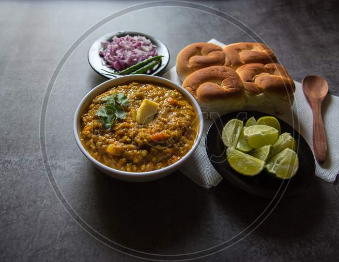 Close up of  pao bhaji or bread and masala curry along