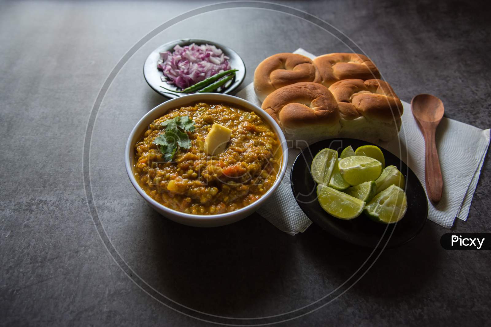 Close up of  pao bhaji or bread and masala curry along