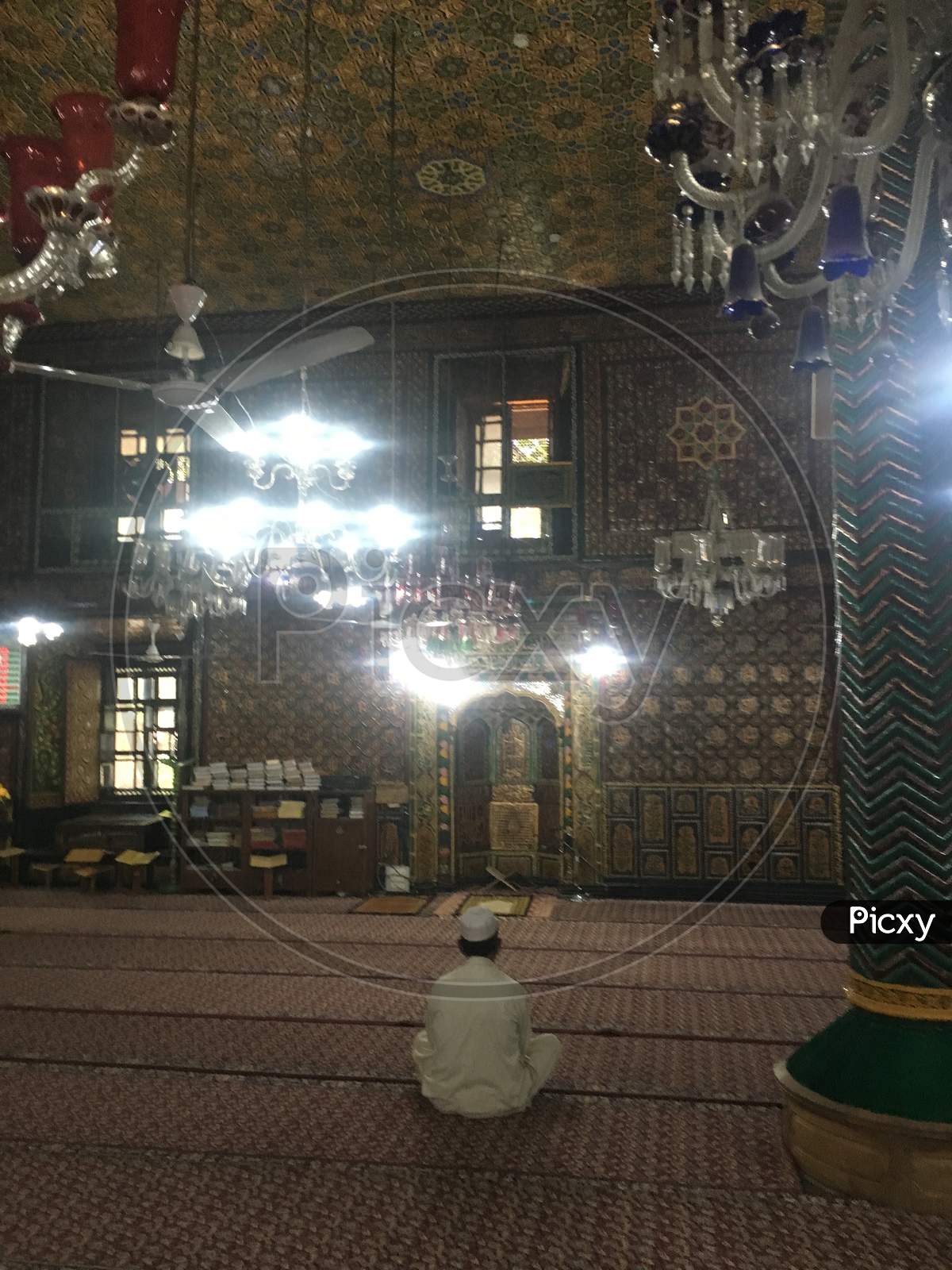 Interior Masjid And A Man Prays In Old Downtown