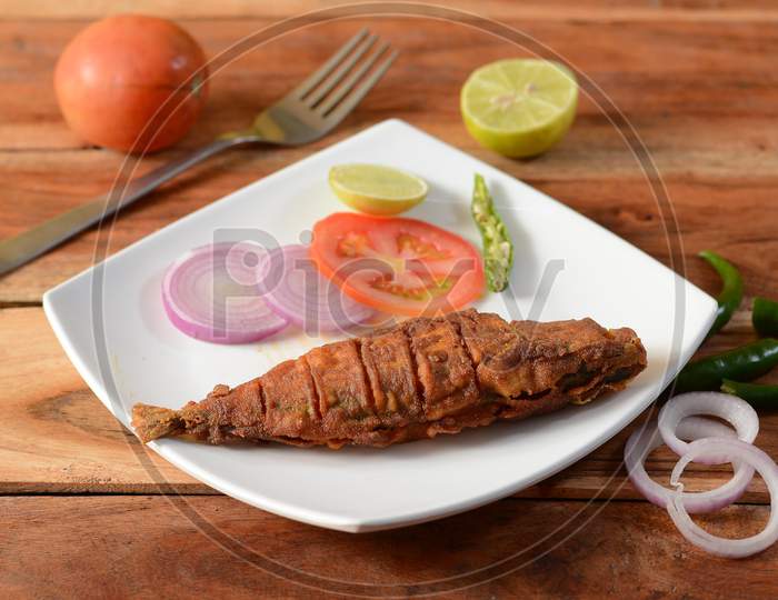 The Indian Mackerel (Rastrelliger Kanagurta) , Malwani Bangda Fry, Fish Fry.. On A Rustic Wooden Background, Selective Focus