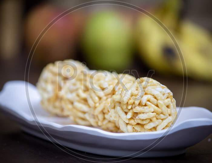 View Of Sweet Puffed Rice Balls(Also Known As Muri, Porri) In A Bowl. Muri Ball Is Famous Sweet Of Indian Subcontinent Made With Muri And Jaggery