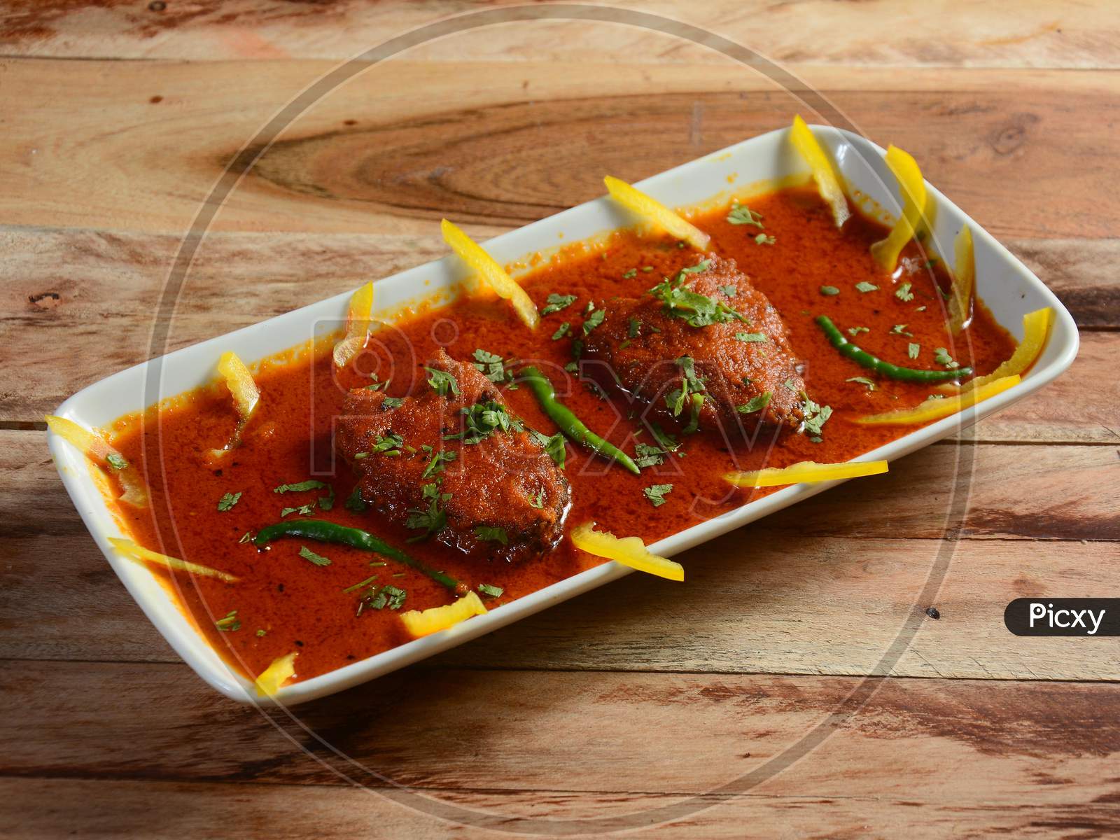 Traditional Bengali Cuisine - Katla Curry Is Bengali Fish Recipe Served On A Ceramic White Bowl, Selective Focus