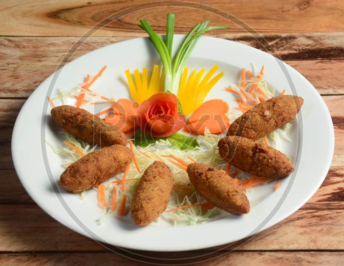 Fish Fingers Served On A Ceramic White Plate, Selective Focus