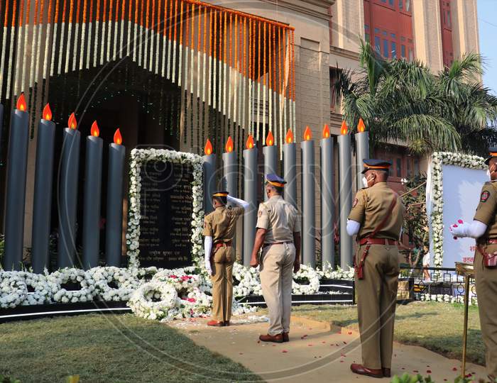 Police officers pay their respects at a memorial to mark the 12th anniversary of the November 26, 2008 attacks, in Mumbai, India November 26, 2020.
